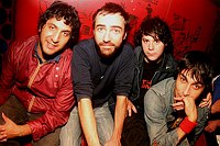 The Shins shot at Fish Bar NYC and at El Maguey Y La Tuna in the Lower East side on Oct. 20, 2003. 

The band is ; 
James Mercer- lead vocals (beard)
 Marty Crandall - keys, vox (blue cap)
 David Hernandez -bass (jeans jacket)
 Jesse Sandoval- drums  (red jacket)

Photo credit; Rahav Segev for The New York Times. 